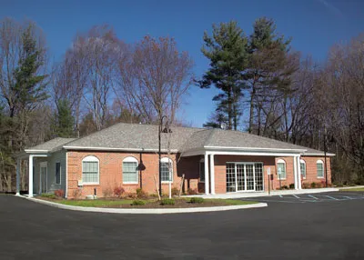 Saratoga County Oral & Maxillofacial Surgery Associates, PLLC office building from the parking lot in Clifton Park