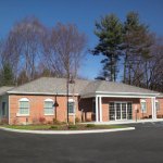 {PRACTICE_NAME} office building from the parking lot in Clifton Park